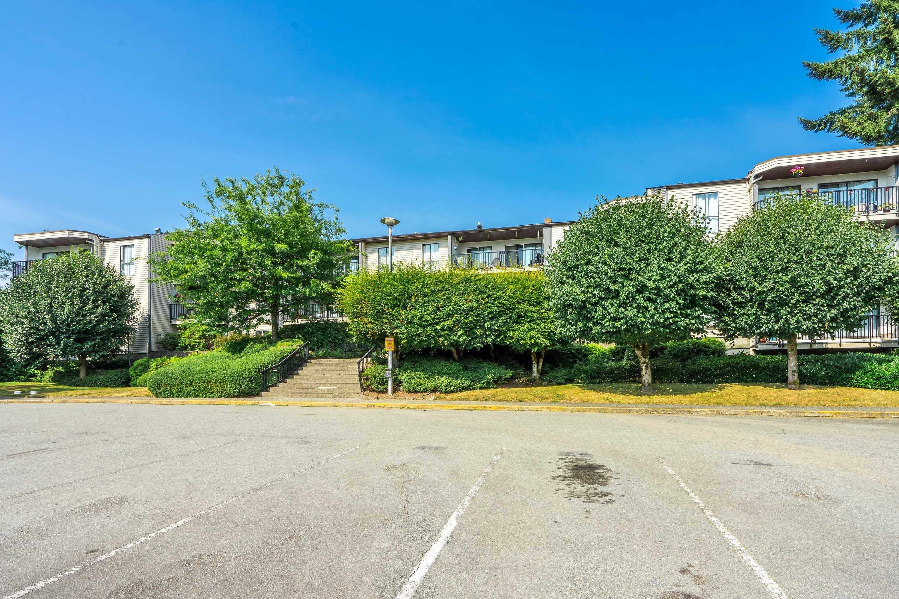 Main Photo: 315 9952 149 Street in Surrey: Guildford Condo for sale in "TALL TIMBERS" (North Surrey)  : MLS®# R2796269