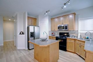 Photo 8: 242 Cougar Plateau Way SW in Calgary: Cougar Ridge Detached for sale : MLS®# A2007391