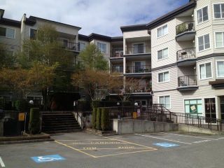 Photo 1: 404 5765 GLOVER Road in Langley: Langley City Condo for sale in "College Court" : MLS®# F1308821