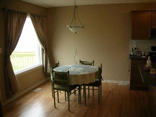 Photo 4: 1212 - 84 Street  SW: House for sale (Summerside) 