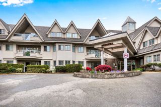 Photo 2: 102 19241 FORD Road in Pitt Meadows: Central Meadows Condo for sale in "Village Green" : MLS®# R2691796
