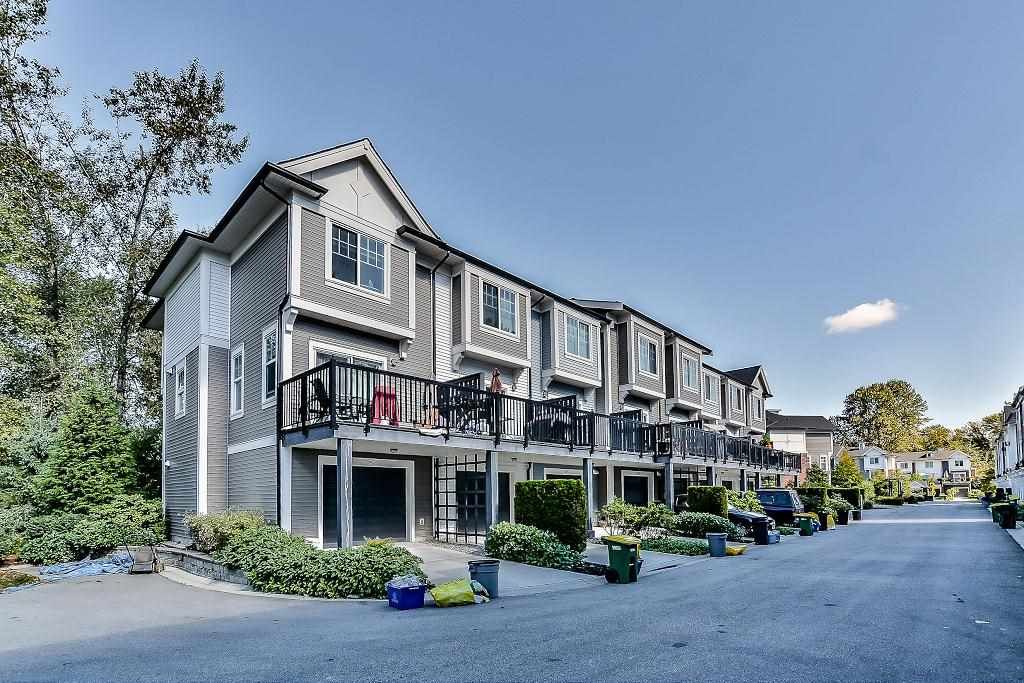Main Photo: 105 3010 RIVERBEND Drive in Coquitlam: Coquitlam East Townhouse for sale in "WESTWOOD" : MLS®# R2109754
