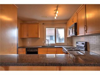 Photo 17: 248 54 GLAMIS Green SW in Calgary: Glamorgan House for sale : MLS®# C4109785