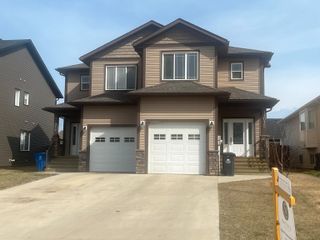 Photo 2: 11012 104A Avenue in Fort St. John: Fort St. John - City NW 1/2 Duplex for sale : MLS®# R2750586