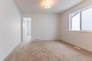 Photo 25: 220 Hotchkiss Drive in Calgary: C-385 Semi Detached (Half Duplex) for sale : MLS®# A2127862