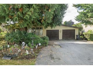 Photo 1: 13874 FALKIRK Drive in Surrey: Bear Creek Green Timbers House for sale : MLS®# R2307470