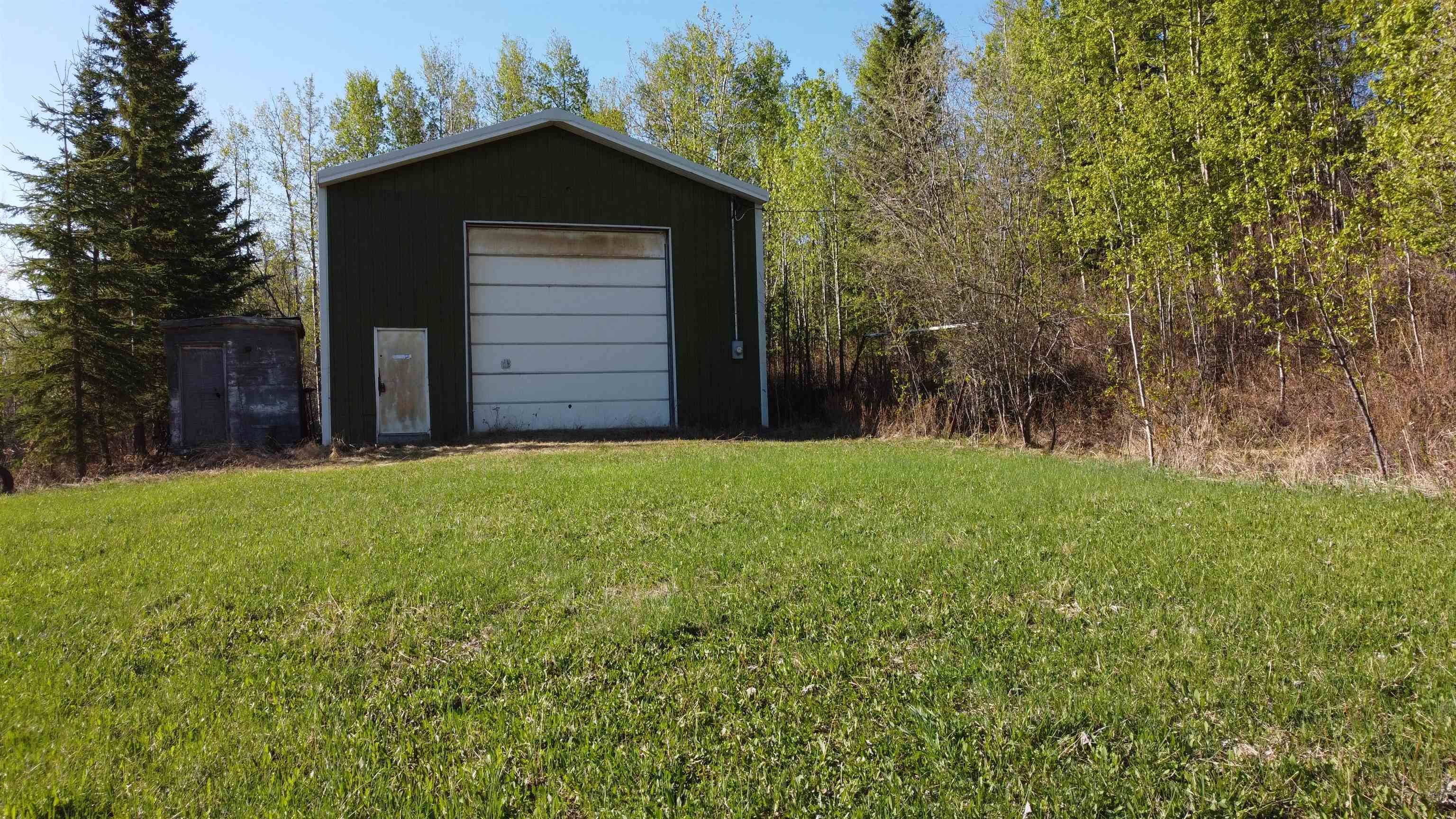 Shop has Power, Concrete Floor, Drain, N/G Heat, 14' Door, Gravel Driveway and Gate Posts with Cable Lock