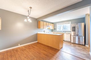 Photo 5: 321 Queenston Heights SE in Calgary: Queensland Row/Townhouse for sale : MLS®# A1201430