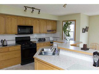 Photo 2: 11 WESTFALL Crescent in : Okotoks Residential Detached Single Family for sale : MLS®# C3619758