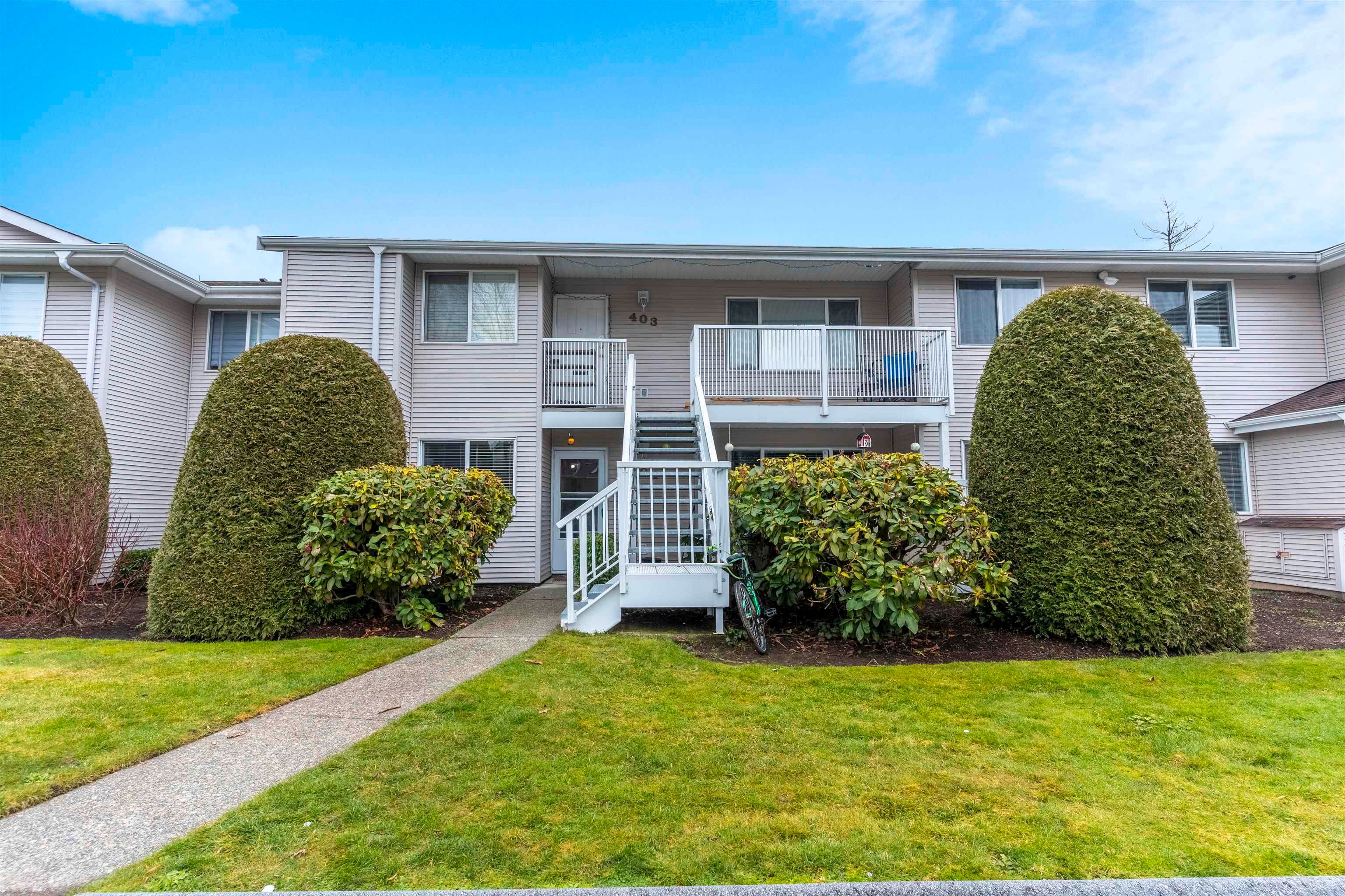 Main Photo: 404 13963 72 Avenue in Surrey: East Newton Townhouse for sale in "NEWTON PARK 1" : MLS®# R2646661