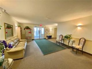 Photo 3: 215 55 Arbour Grove Close NW in Calgary: Arbour Lake Apartment for sale : MLS®# A1223442