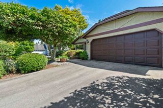 Photo 1: 1115 LOMBARDY Drive in Port Coquitlam: Lincoln Park PQ House for sale : MLS®# R2606329