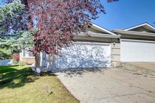 Photo 1: 297 Arbour Cliff Close NW in Calgary: Arbour Lake Semi Detached (Half Duplex) for sale : MLS®# A1255400