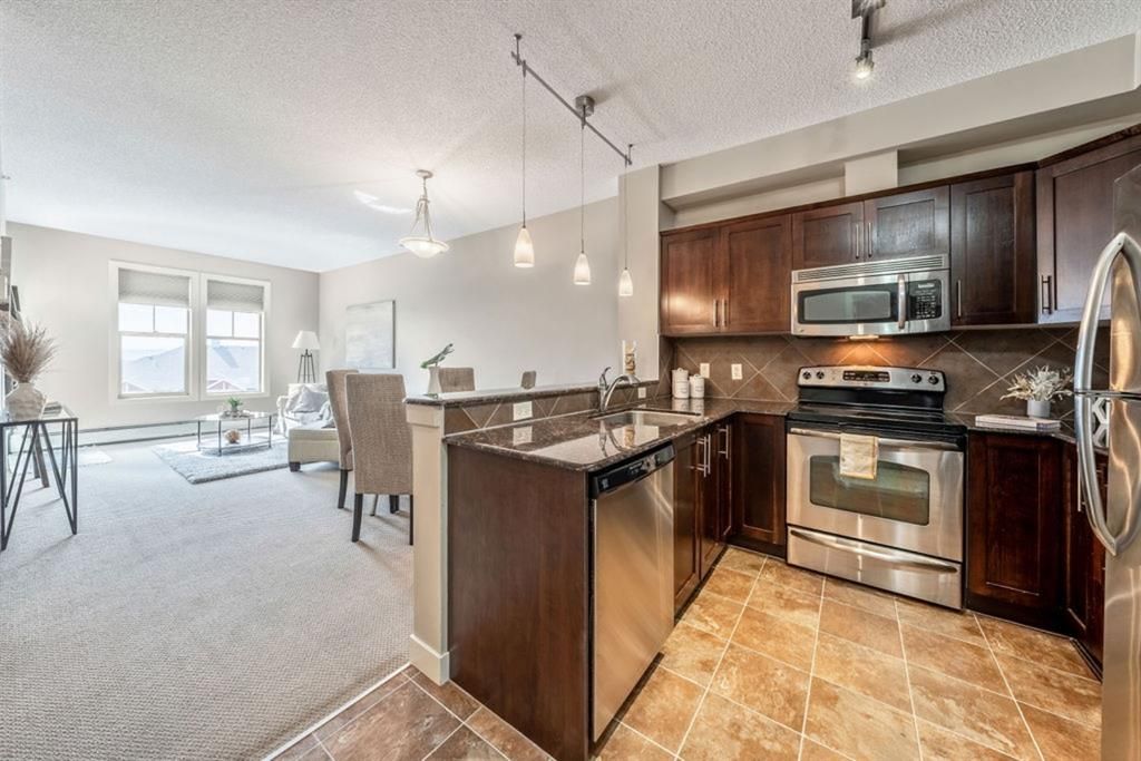 Main Photo: 417 201 Sunset Drive: Cochrane Apartment for sale : MLS®# A1245590