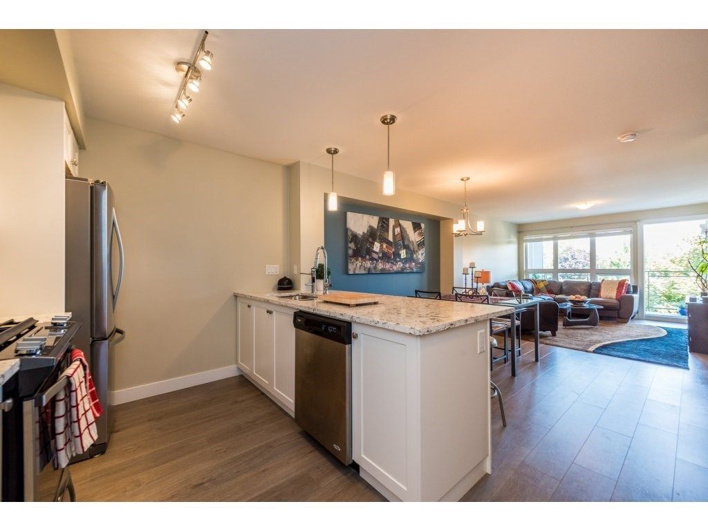 Main Photo: 308 4815 55B Street in Ladner: Hawthorne Condo for sale in "THE POINTE" : MLS®# R2466167