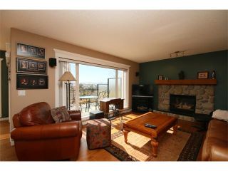 Photo 7: 51 GLENEAGLES View: Cochrane House for sale : MLS®# C4008842