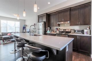 Photo 6: 153 PANATELLA Square NW in Calgary: Panorama Hills Row/Townhouse for sale : MLS®# C4305575