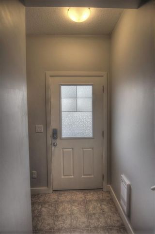 Photo 3: 1706 250 SAGE VALLEY Road NW in Calgary: Sage Hill Row/Townhouse for sale : MLS®# A1197332