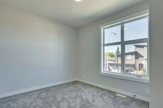 Photo 29: 1104 40 Street SW in Calgary: Rosscarrock Row/Townhouse for sale : MLS®# A1034743