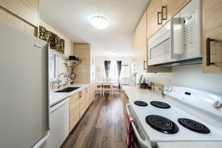 Photo 7: 7632 24A Street SE in Calgary: Ogden Row/Townhouse for sale : MLS®# A1194630
