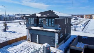 Photo 2: 68 Coulee Crescent SW in Calgary: Cougar Ridge Detached for sale : MLS®# A2030060