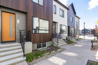 Photo 2: 320 Redstone Crescent NE in Calgary: Redstone Row/Townhouse for sale : MLS®# A1243729