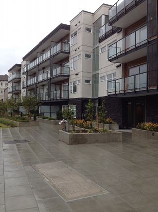 Photo 1: 104 12070 227 Street in Maple Ridge: East Central Condo for sale in "STATION ONE" : MLS®# R2022552