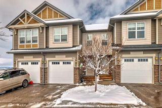 Photo 1: 647 101 Sunset Drive: Cochrane Row/Townhouse for sale : MLS®# A2119340