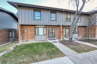 Photo 1: 77 10940 Bonaventure Drive SE in Calgary: Willow Park Row/Townhouse for sale : MLS®# A2092517