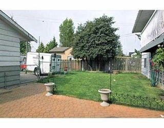 Photo 3: 1402 COMO LAKE AV in Coquitlam: Central Coquitlam House for sale : MLS®# V536066