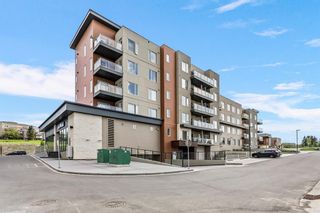 Photo 2: 409 71 Shawnee Common SW in Calgary: Shawnee Slopes Apartment for sale : MLS®# A2052005