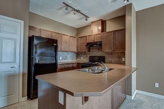 Photo 7: 1407 92 CRYSTAL SHORES Road: Okotoks Apartment for sale : MLS®# A1222250
