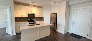 Photo 2: 209 500 Auburn Meadows Common SE in Calgary: Auburn Bay Apartment for sale : MLS®# A2108589