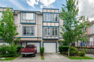 Photo 1: 28 13899 LAUREL Drive in Surrey: Whalley Townhouse for sale in "Emerald Gardens" (North Surrey)  : MLS®# R2465107