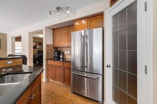 Photo 13: 200 Cougartown Close SW in Calgary: Cougar Ridge Detached for sale : MLS®# A2124049
