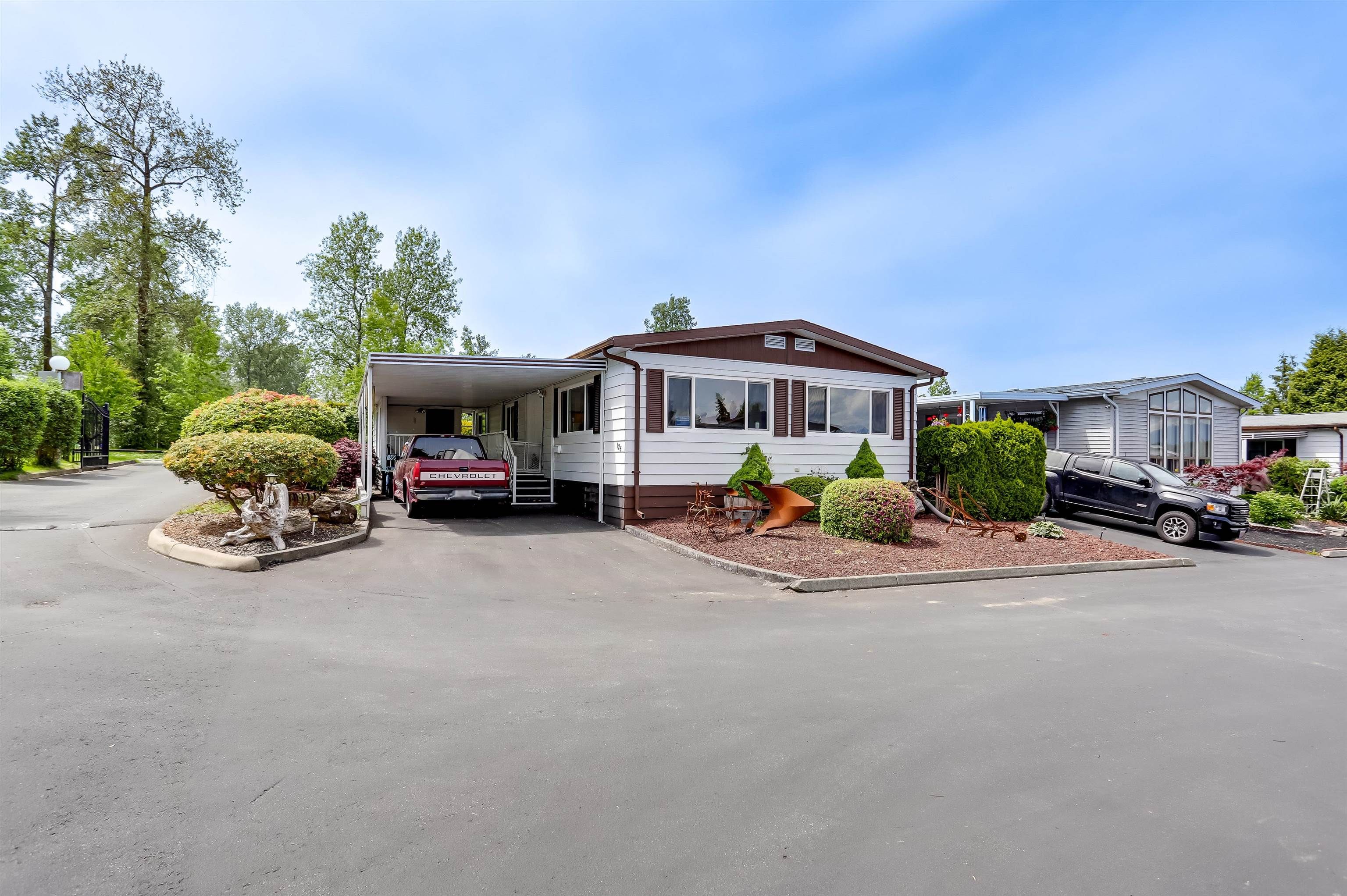 Main Photo: 126 8234 134 Street in Surrey: Queen Mary Park Surrey Manufactured Home for sale in "West Wood Gate" : MLS®# R2697305