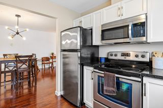 Photo 4: 103 523 WHITING Way in Coquitlam: Coquitlam West Condo for sale in "Brookside Manor" : MLS®# R2867681