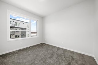 Photo 19: 50 Cranbrook Gardens SE in Calgary: Cranston Row/Townhouse for sale : MLS®# A2037909