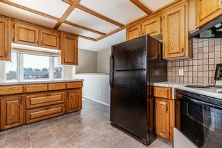 Photo 6: 1102 Whitfield Avenue: Crossfield Detached for sale : MLS®# A1144920