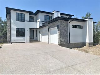 Photo 1: 31 Rockford Park NW in Calgary: Rocky Ridge Detached for sale : MLS®# A1151305