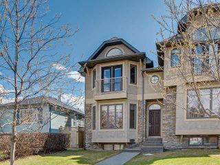 Photo 1: 209 26 AVE NW in CALGARY: Tuxedo Park Residential Attached for sale (Calgary)  : MLS®# C3614703