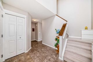 Photo 3: 109 Cougar Plateau Mews SW in Calgary: Cougar Ridge Detached for sale : MLS®# A2144962