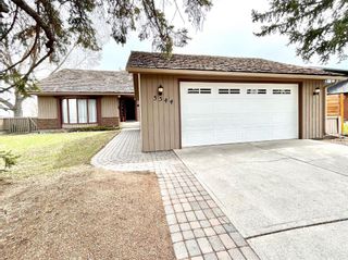 Photo 1: 3344 Palliser Drive SW in Calgary: Oakridge Detached for sale : MLS®# A2114409