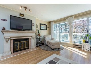 Photo 1: 203 2733 ATLIN Place in Coquitlam: Coquitlam East Condo for sale in "ATLIN COURT" : MLS®# V1142797
