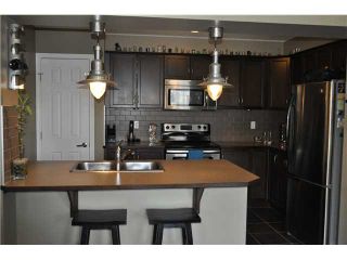 Photo 3: 64 WINDSTONE Green SW: Airdrie Townhouse for sale : MLS®# C3566494