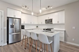 Photo 2: 408 100 Auburn Meadows Manor SE in Calgary: Auburn Bay Apartment for sale : MLS®# A2107067