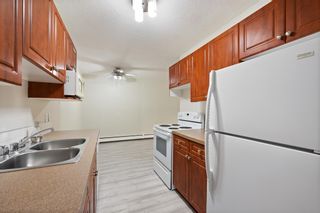 Photo 8: 115 3420 50 Street NW in Calgary: Varsity Apartment for sale : MLS®# A2052352