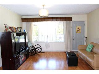 Photo 3: 5112 HOY Street in Vancouver: Collingwood VE House for sale (Vancouver East)  : MLS®# V1065249