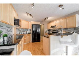 Photo 11: 69 STRATHLEA Place SW in Calgary: Strathcona Park House for sale : MLS®# C4101174