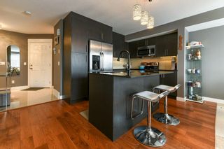 Photo 8: 11 West Coach Manor SW in Calgary: West Springs Row/Townhouse for sale : MLS®# A2035861